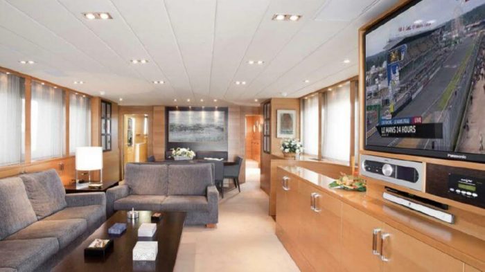 Plush main room interior and television on Benetti 95 Yacht