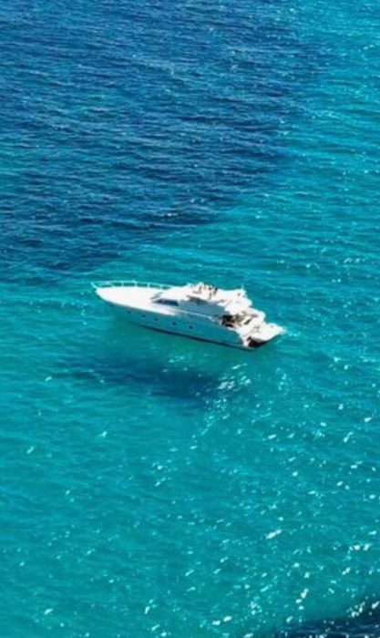Distant shot of Ferretti yacht in Ocean