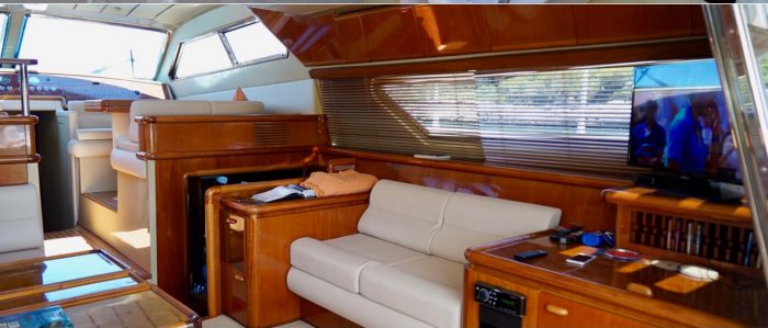1996 Ferretti Yachts luxury wooden interiors and leather couch