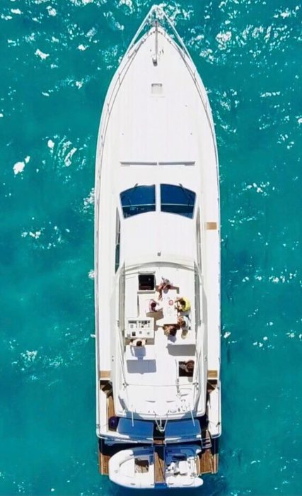 Arial shot of Ferretti Yacht in clear blue waters
